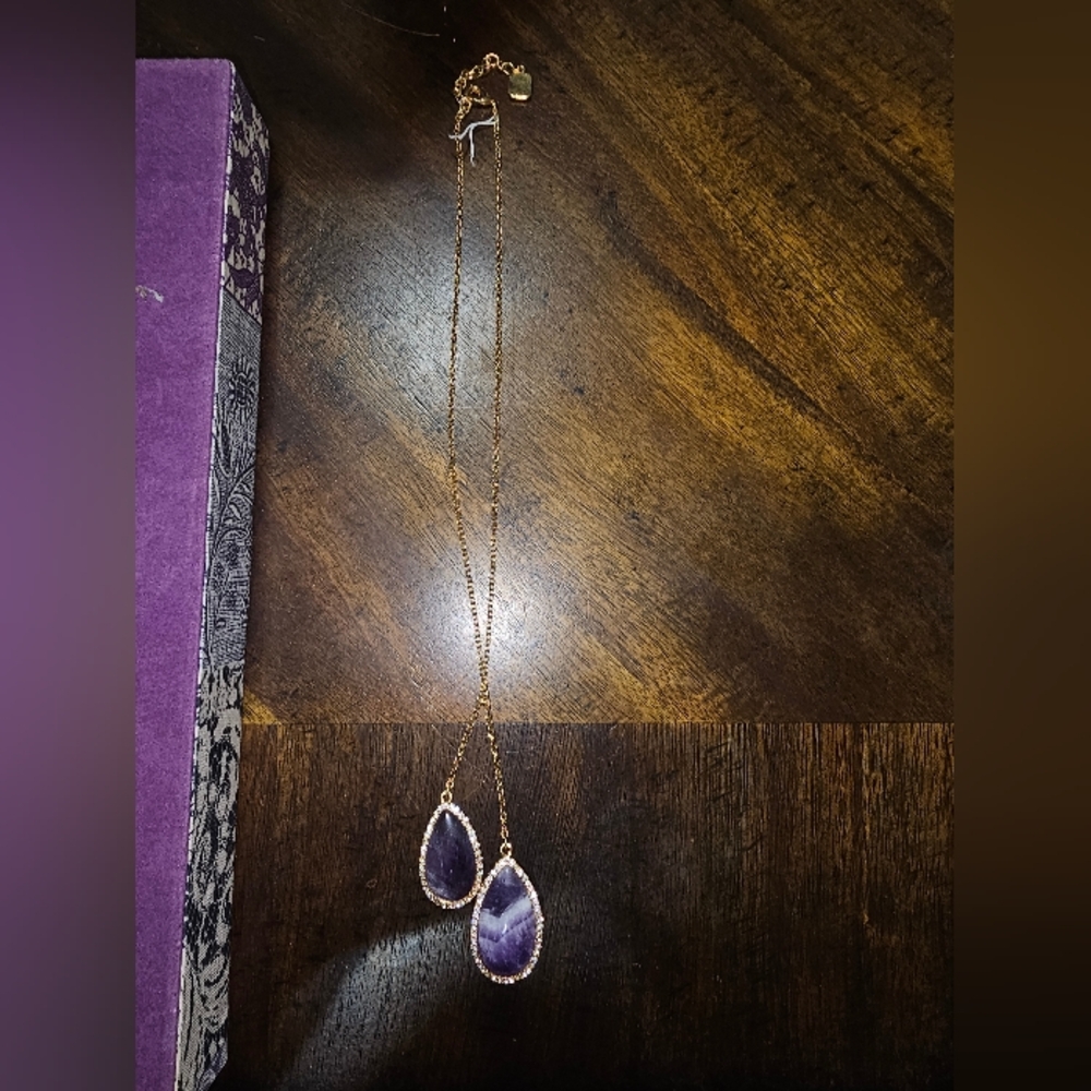 Gold necklace with amethyst charm